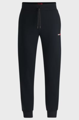 Cotton-blend tracksuit bottoms with heart logo, Black