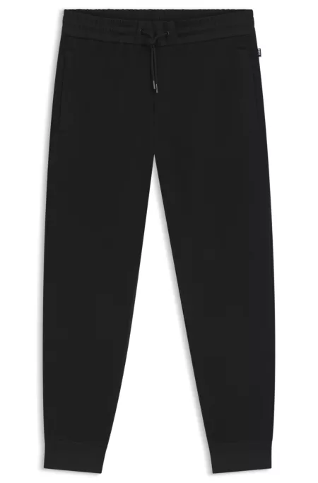Pantalon de survêtement en coton stretch avec bas de jambes resserrés