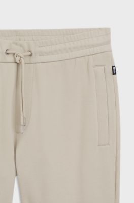 Stretch-cotton tracksuit bottoms with cuffed hems, Light Beige