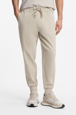Stretch-cotton tracksuit bottoms with cuffed hems, Light Beige