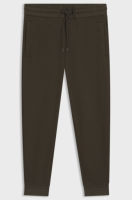 Stretch-cotton tracksuit bottoms with cuffed hems, Dark Green