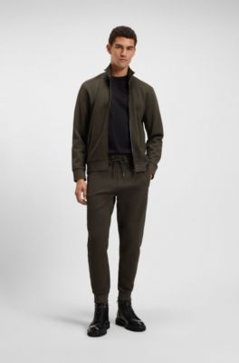 Pantalon de surv&ecirc;tement en coton stretch avec bas de jambes resserr&eacute;s, Vert sombre
