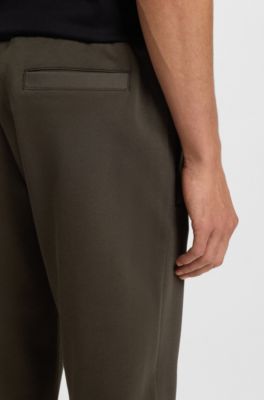 Stretch-cotton tracksuit bottoms with cuffed hems, Dark Green