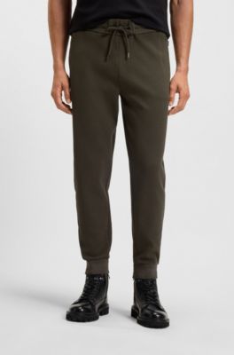 Stretch-cotton tracksuit bottoms with cuffed hems, Dark Green