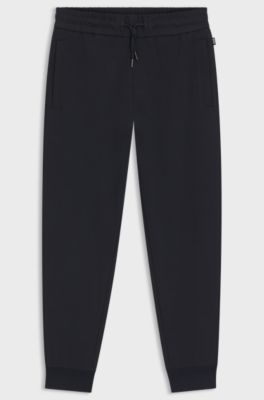 Stretch-cotton tracksuit bottoms with cuffed hems, Dark Blue
