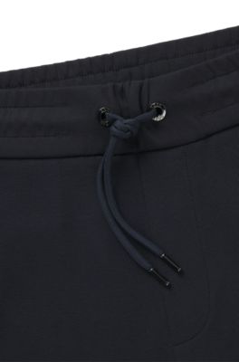 Stretch-cotton tracksuit bottoms with cuffed hems, Dark Blue
