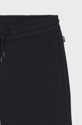 Stretch-cotton tracksuit bottoms with cuffed hems, Dark Blue