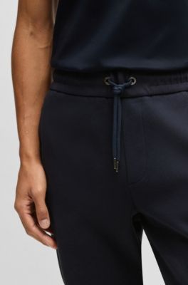 Stretch-cotton tracksuit bottoms with cuffed hems, Dark Blue