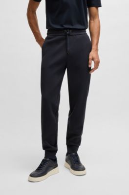 Stretch-cotton tracksuit bottoms with cuffed hems, Dark Blue