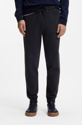 Stretch-cotton tracksuit bottoms with cuffed hems, Dark Blue