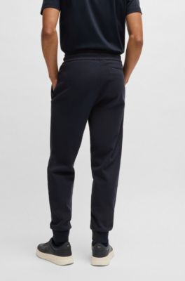 Stretch-cotton tracksuit bottoms with cuffed hems, Dark Blue