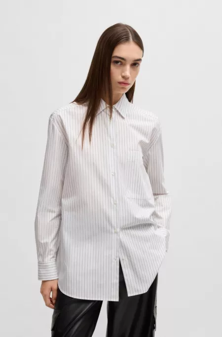 Oversized-fit blouse in striped cotton with butterfly print