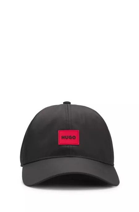 Six-panel cap with silicone logo patch