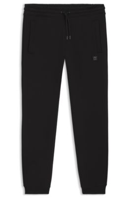 Cotton-blend tracksuit bottoms with stacked logo, Black