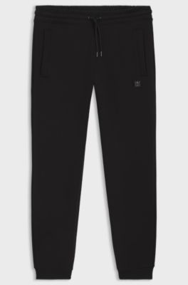 Cotton-blend tracksuit bottoms with stacked logo, Black