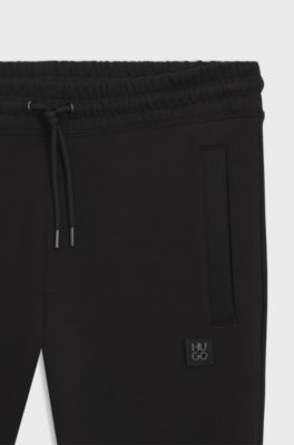 Cotton-blend tracksuit bottoms with stacked logo, Black