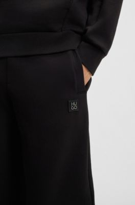 Cotton-blend tracksuit bottoms with stacked logo, Black