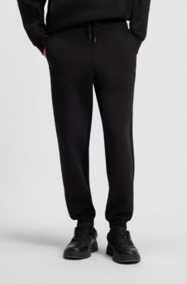Trainingsbroek van een katoenmix met tweedelig logo, Zwart