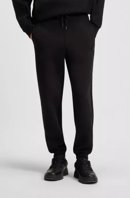 Cotton-blend tracksuit bottoms with stacked logo