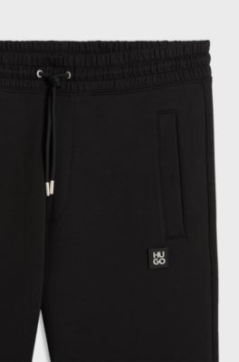 Cotton-blend tracksuit bottoms with stacked logo, Black