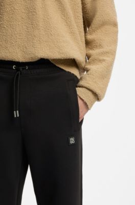 Cotton-blend tracksuit bottoms with stacked logo, Black