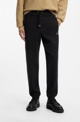 Cotton-blend tracksuit bottoms with stacked logo, Black