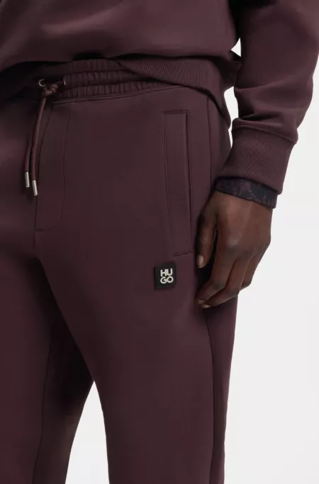 Cotton-blend tracksuit bottoms with stacked logo
