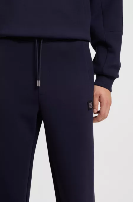 Cotton-blend tracksuit bottoms with stacked logo
