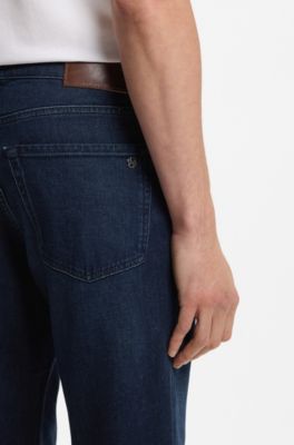 Jeans con fit affusolato in denim elasticizzato blu puro, Blu scuro