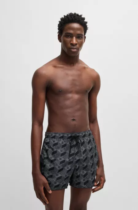 Seasonal-print swim shorts with round hem