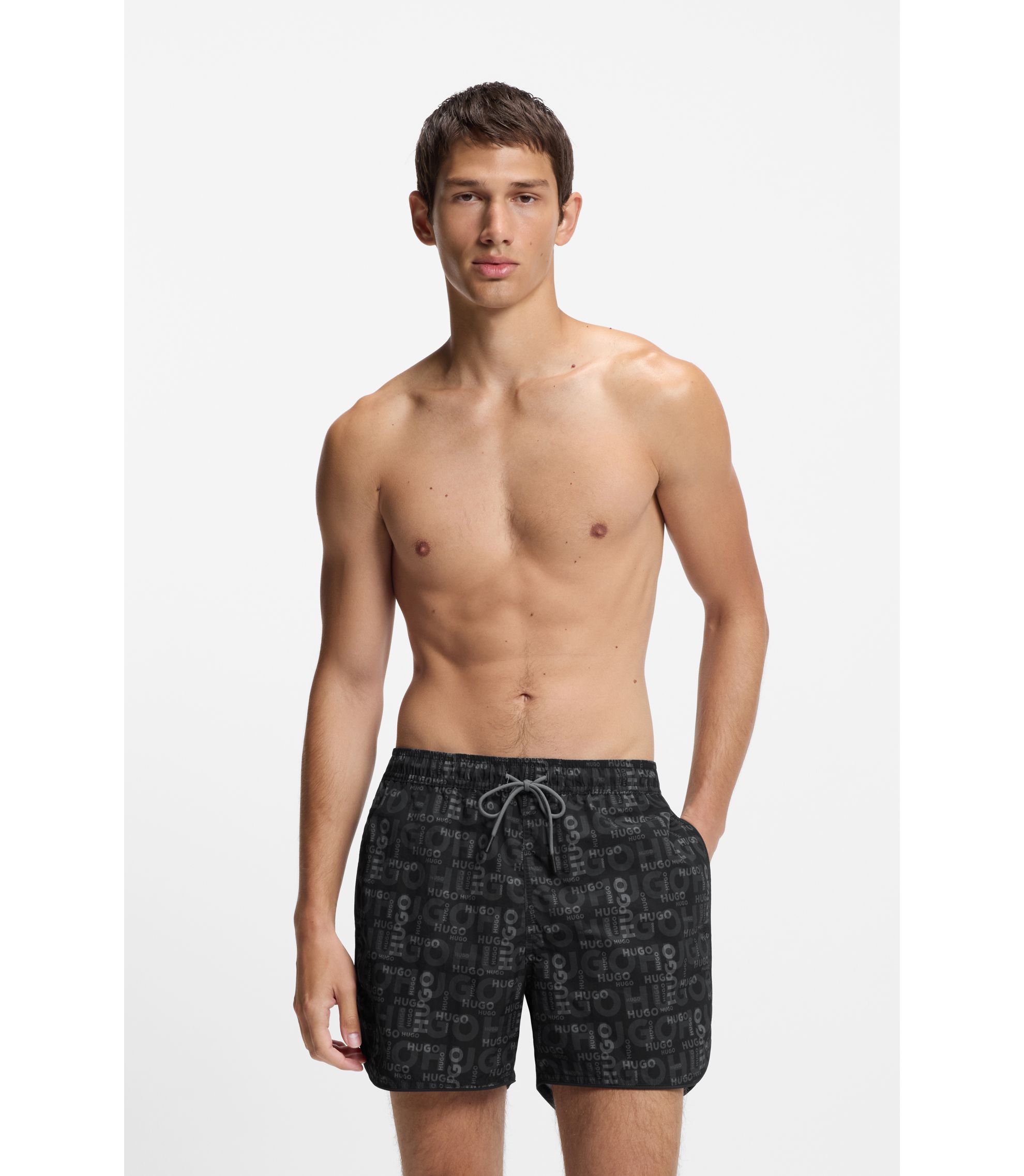 Badeshorts mit saisonalem Print und abgerundetem Saum