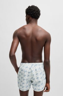 Badeshorts mit saisonalem Print und abgerundetem Saum, Hellblau