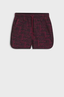 Badeshorts mit saisonalem Print und abgerundetem Saum, Dunkelrot