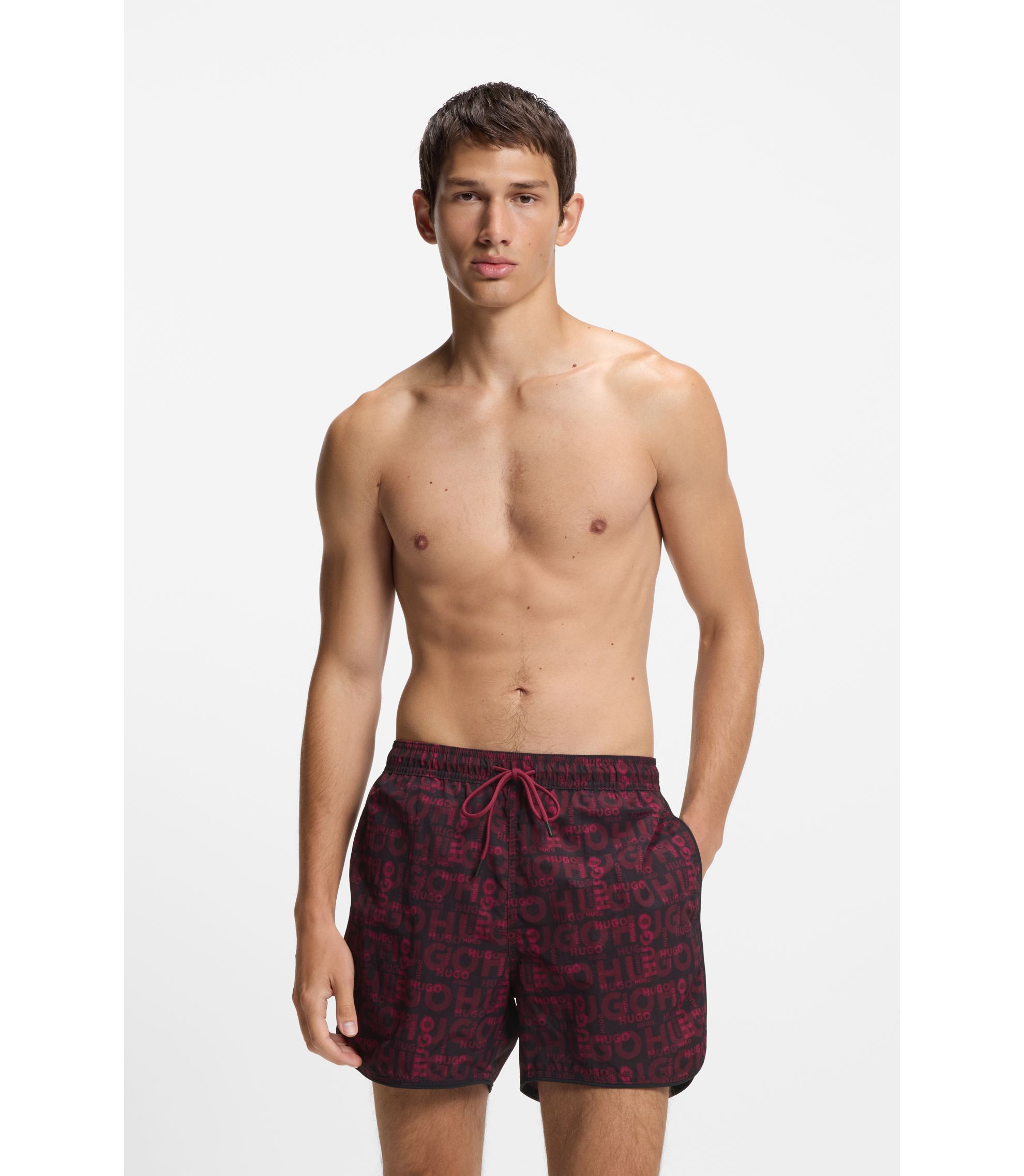 Badeshorts mit saisonalem Print und abgerundetem Saum