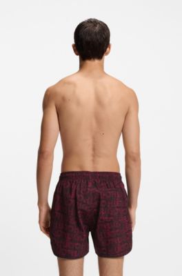 Badeshorts mit saisonalem Print und abgerundetem Saum, Dunkelrot