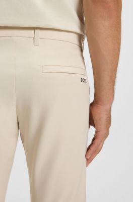 Slim fit-byxor i vattenavvisande stretchmaterial, Naturf&auml;rg
