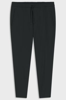 Pantalon Tapered en tissu stretch d&eacute;perlant, Noir