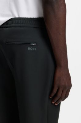 Tapered-fit trousers in water-repellent stretch fabric, Black