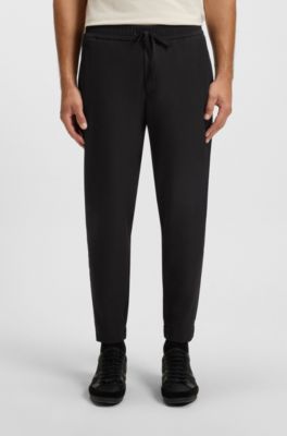 Tapered-fit trousers in water-repellent stretch fabric, Black