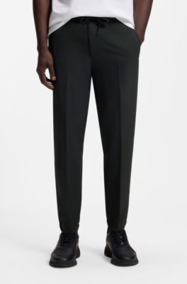 Pantaloni con fit affusolato in tessuto elasticizzato idrorepellente, Nero