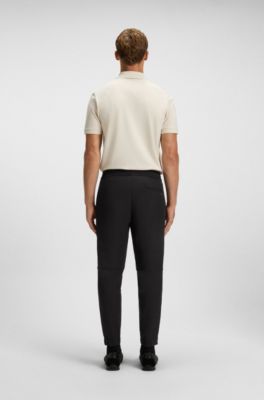 Tapered-fit trousers in water-repellent stretch fabric, Black