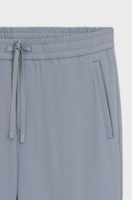 Pantalon Tapered en tissu stretch d&eacute;perlant, Gris