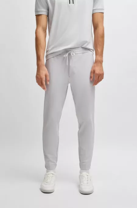 Tapered-fit trousers in water-repellent stretch fabric