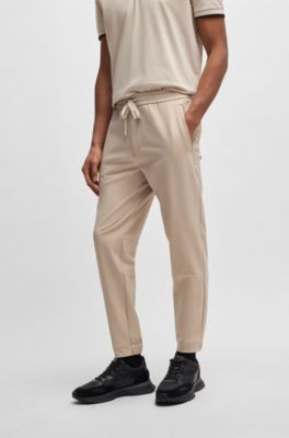 Pantalon Tapered en tissu stretch d&eacute;perlant, Beige