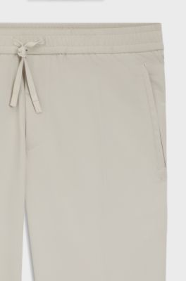 Pantaloni con fit affusolato in tessuto elasticizzato idrorepellente, Beige chiaro