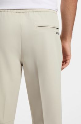 Pantaloni con fit affusolato in tessuto elasticizzato idrorepellente, Beige chiaro