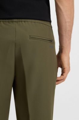 Tapered-fit trousers in water-repellent stretch fabric, Olive