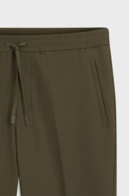 Tapered-fit trousers in water-repellent stretch fabric, Dark Green