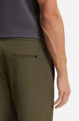 Pantaloni con fit affusolato in tessuto elasticizzato idrorepellente, Verde scuro