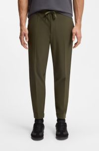 Tapered-fit trousers in water-repellent stretch fabric, Dark Green